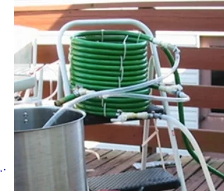 Figure: A self-made shell and tube exchanger being used for wort cooling by a home brewer